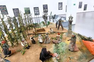 Historical diorama of a traditional hop field